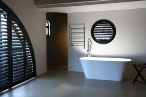 circular plantation shutters in a bathroom