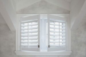 plantation shutters highlight an open window