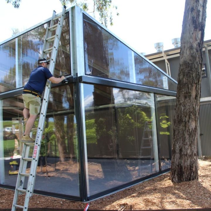 DB Team Installing Roofing System aspect ratio 465 450